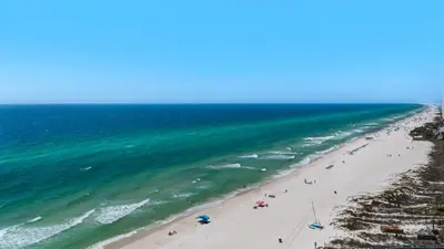 an overhead view of a beach with people and the ocean at Palazzo 806 in Panama City Beach