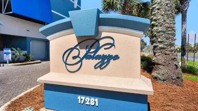 a sign for the entrance to a building at Palazzo 806 in Panama City Beach