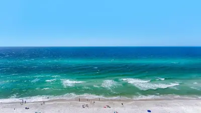 a view of the ocean with people on the beach at Palazzo 806 in Panama City Beach