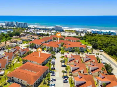 an aerial view of a resort with the beach at Condo w/beach, pools, tennis, shuffleboard, more! in Panama City Beach