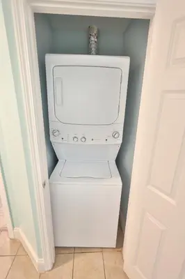 a white washer and dryer in a room at Lake Town Charming Condo Steps from the Beach in Panama City Beach