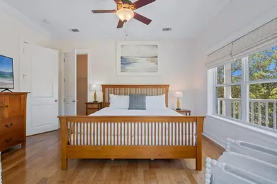 a bedroom with a bed and a ceiling fan at Ocean Glory 30A in Inlet Beach