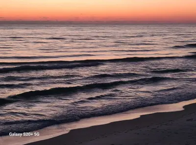 a sunset over the ocean with a beach at Fontainebleau Terrace #430 in Panama City Beach