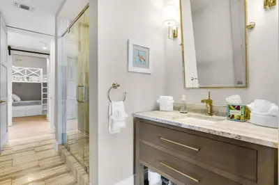 a bathroom with a sink and a shower at Casa Del Oro Penthouse at Barrett Square - Downtown Rosemary Beach Pool &Hot Tub Access in Rosemary Beach
