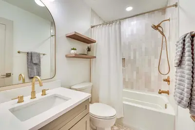 a bathroom with a sink and a toilet and a shower at Steps to Sand Condo with Pool in Panama City Beach in Panama City Beach