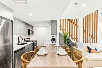 a kitchen and dining room with a table and chairs at Ocean Breeze 5D in Panama City Beach