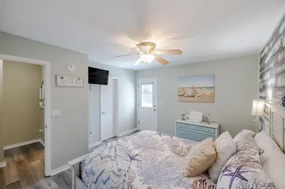 a bedroom with a bed and a ceiling fan at Captain's Quarters at Gulf Highlands Beach Resort in Panama City Beach