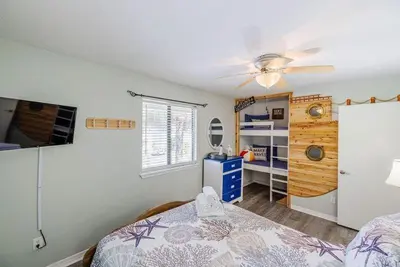 a bedroom with a bed and a ceiling fan at Captain's Quarters at Gulf Highlands Beach Resort in Panama City Beach