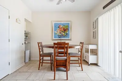 a dining room with a table and chairs at Beach Walkers by Beach Haven Vacation Rentals in Panama City Beach