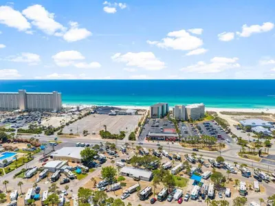 an aerial view of a parking lot next to the beach at Top of the Gulf 507 Beach Front Resort Ocean View in Panama City Beach