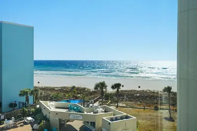 a view of the beach from the balcony of a condo at Top of the Gulf 507 Beach Front Resort Ocean View in Panama City Beach
