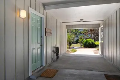 a hallway of a house with a green door at Seagrove Siesta at Beachwood Villages - Walk to Beach Outdoor Pools & More in Santa Rosa Beach