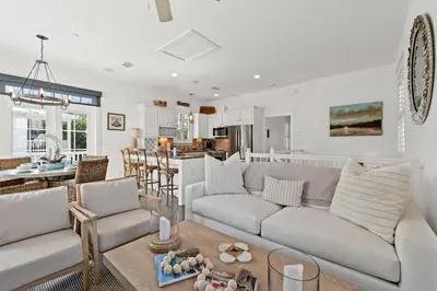 a living room with a couch and a table at 30A Sunset Beach House - Villa Infinity by Panhandle Getaways in Seacrest