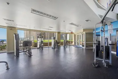 a gym with cardio equipment in a building at Laketown Wharf #1231 in Panama City Beach