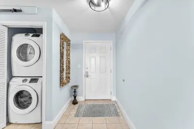 a laundry room with a washer and dryer at Laketown Wharf #1231 in Panama City Beach