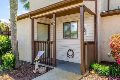 a small house with a gate and a door at Portside Resort AA1 by InJoy Vacations in Panama City Beach