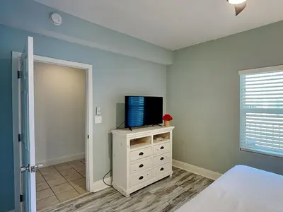 a bedroom with a bed and a tv on a dresser at Laketown Wharf #1137 in Panama City Beach