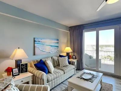 a living room with a couch and a table at Laketown Wharf #1137 in Panama City Beach