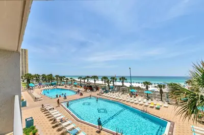 an overhead view of a swimming pool and the beach at The Summit 312 in Panama City Beach