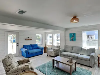 a living room with couches and a blue couch at Salt & Sea A in Panama City Beach