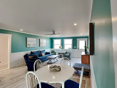 a living room with a table and a couch at Salt & Sea C in Panama City Beach