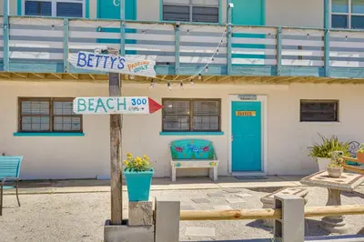 a street sign in front of a building at Steps to Sand Panama City Beach Apartment! in Panama City Beach