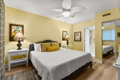 a bedroom with a bed and a ceiling fan at Emerald Beach Resort 1834 - Beachfront with Stunning Views by Beach Haven Vacation Rentals in Panama City Beach