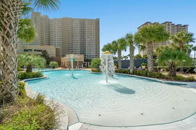 a large swimming pool with a fountain in a city at Emerald Beach Resort 1834 - Beachfront with Stunning Views by Beach Haven Vacation Rentals in Panama City Beach