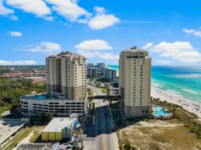two tall buildings next to the beach and the ocean at Grand Panama 1005 - Tower Two - 2 bedroom - Large Deck with Gulf Views by Beach Haven Vacation Rentals in Panama City Beach