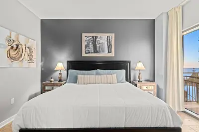 a bedroom with a large bed and two nightstand tables at Origin 0524 - One Bedroom - Beautiful Gulf Views! by Beach Haven Vacation Rentals in Panama City Beach