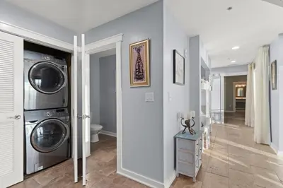 a laundry room with a washer and dryer at Origin 0524 - One Bedroom - Beautiful Gulf Views! by Beach Haven Vacation Rentals in Panama City Beach