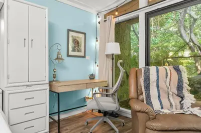a home office with a desk and a chair at Zen Studio by Beach Haven Vacation Rentals in Panama City Beach