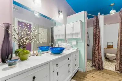 a bathroom with two blue bowls on a white dresser at Zen Studio by Beach Haven Vacation Rentals in Panama City Beach