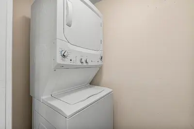 a white washer and dryer in a room at The Yard by Beach Haven Vacation Rentals in Panama City Beach