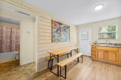 a kitchen with a table and a sink in a room at The Yard by Beach Haven Vacation Rentals in Panama City Beach