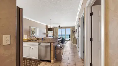 a kitchen with a sink and a counter at Emerald Isle 403 by Emerald Coast Retreats in Panama City Beach