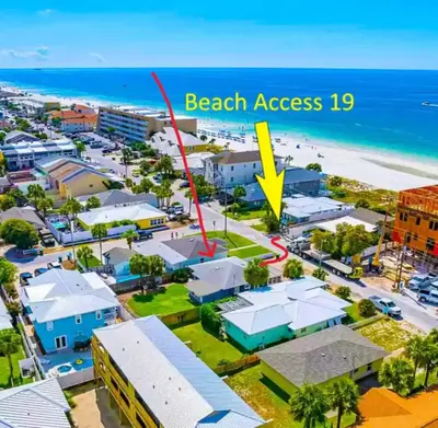 an aerial view of a beach area with a yellow arrow labeling beach access at Surf Shack - Steps to the beach, lush fenced backyard by Beach Haven Vacation Rentals in Panama City Beach