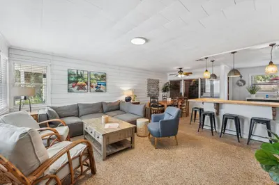 a living room with a couch and a bar at Summer Haven by Beach Haven Vacation Rentals in Panama City Beach