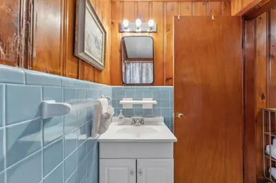 a bathroom with a sink and a mirror at Summer Haven by Beach Haven Vacation Rentals in Panama City Beach