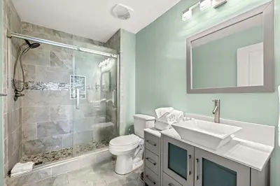 a bathroom with a toilet and a sink and a shower at Origin 0615 - Studio King - Stylish Unit with City Views by Beach Haven Vacation Rentals in Panama City Beach