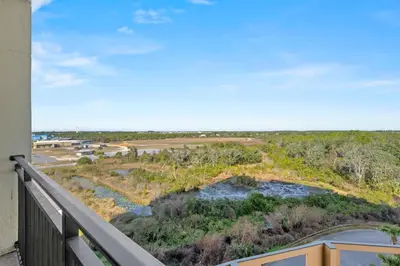 a view of a river from the balcony of a house at Origin 0615 - Studio King - Stylish Unit with City Views by Beach Haven Vacation Rentals in Panama City Beach