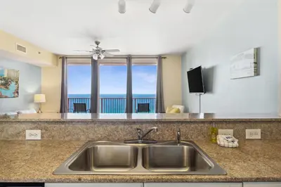 a kitchen sink with a view of the ocean at Shores of Panama 2219 by Beach Haven Vacation Rentals in Panama City Beach