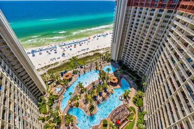 an aerial view of the pools and beach at a resort at Shores of Panama 2219 by Beach Haven Vacation Rentals in Panama City Beach