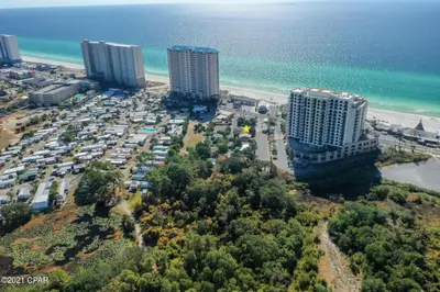 an aerial view of a parking lot next to the beach at Sea Shed by Beach Haven Vacation Rentals in Panama City Beach