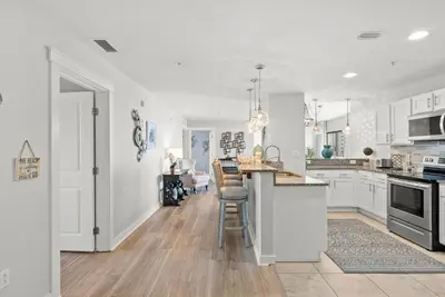 a kitchen with white cabinets and a counter top at Origin 1706 - PENTHOUSE - Three Bedroom- Stylish Gulf View by Beach Haven Vacation Rentals in Panama City Beach
