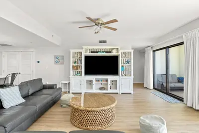 a living room with a couch and a tv at Origin 1506 - Private Rooftop Balcony - Four Bedroom PENTHOUSE - Gorgeous Sunset Views! in Panama City Beach