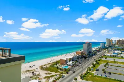 a view of the beach and ocean from a building at Origin 1501 - PENTHOUSE - Three Bedroom - Gulf and Bay Views by Beach Haven Vacation Rentals in Panama City Beach