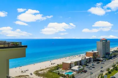 a view of a beach and the ocean from a building at Origin 1501 - PENTHOUSE - Three Bedroom - Gulf and Bay Views by Beach Haven Vacation Rentals in Panama City Beach