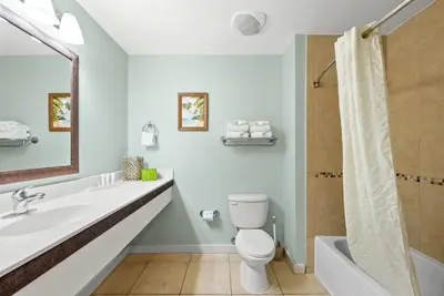 a bathroom with a toilet and a sink and a shower at Origin 1319 - Studio King - City View - Amazing Value by Beach Haven Vacation Rentals in Panama City Beach