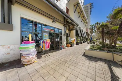 a store on a street with a stack of towels at Origin 1231 - One Bedroom - Sunrise and Gulf Views by Beach Haven Vacation Rentals in Panama City Beach